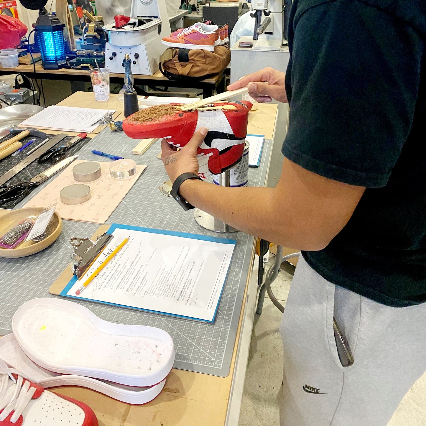 The application of cork to the void on a traditional lasting style to create a smooth bottom prior to attaching the sole to your custom made upper.